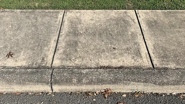 Sidewalk before pressure washing.