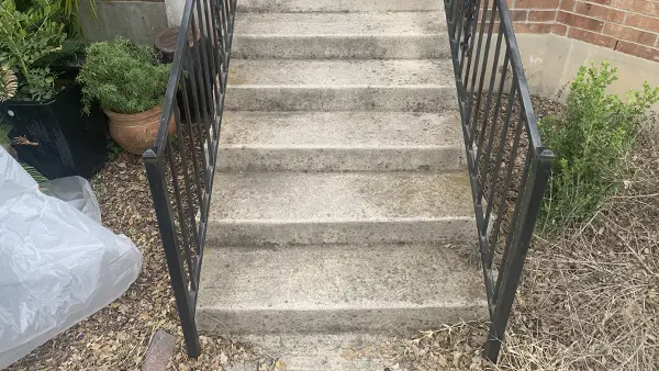 Stairs before pressure washing.