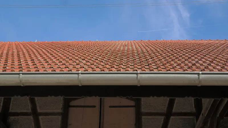A photo of gutters and a roof.