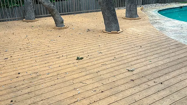 A dirty deck covered in mold and mildew.
