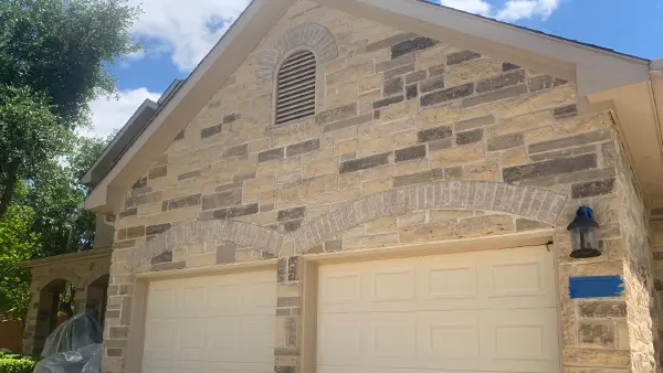 A clean brick garage, after getting washed.