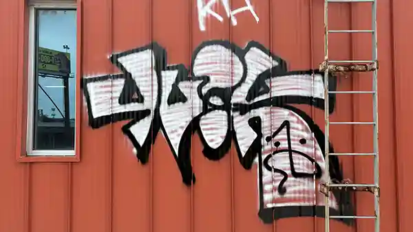 A wall with graffiti on it.