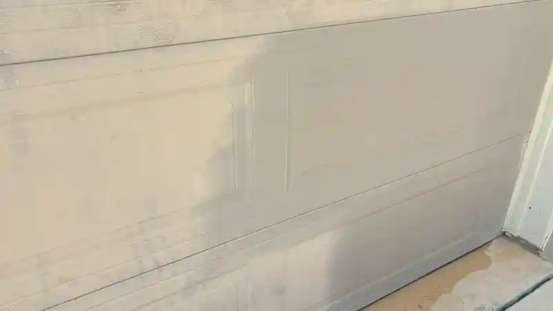 Oxidation, before and after being removed from a garage door.