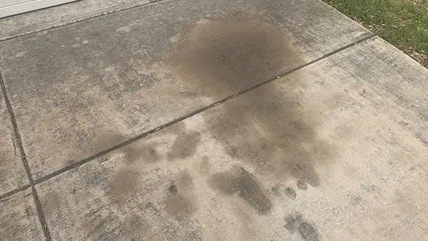 An oil stain on a driveway.