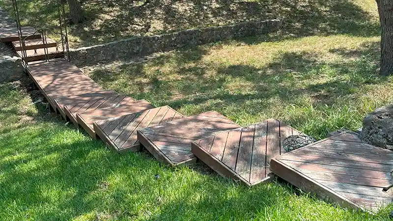 Wooden steps with a failing oil-based paint.