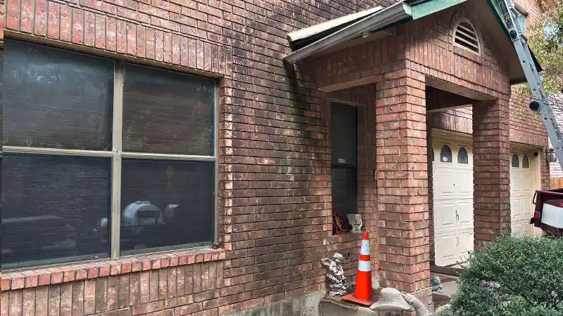 A home covered in mold and mildew stains.