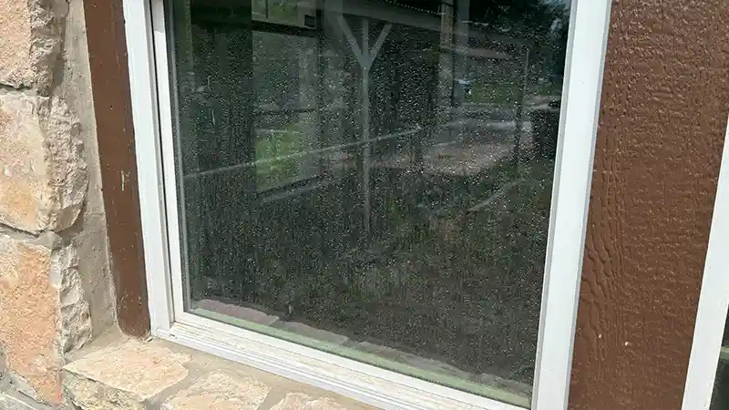 A dirty residential window.