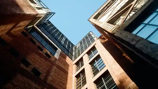 A bottom-up view of a commercial building.
