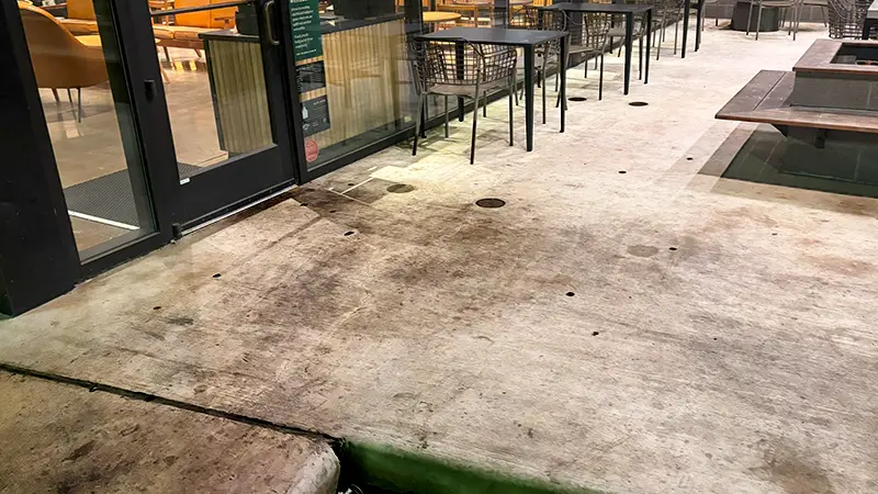 Heavy foot traffic stains on concrete.