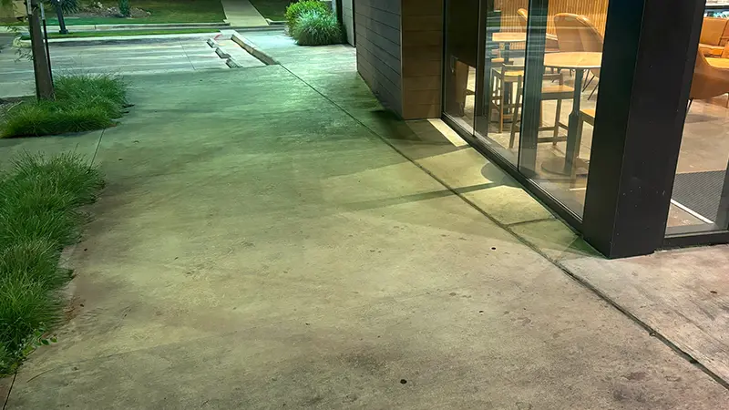 Concrete with foot traffic marks.