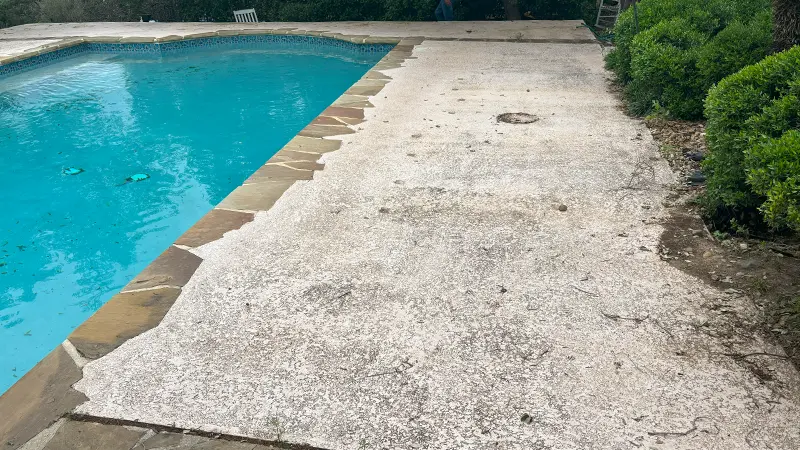 A dirty white pool deck.