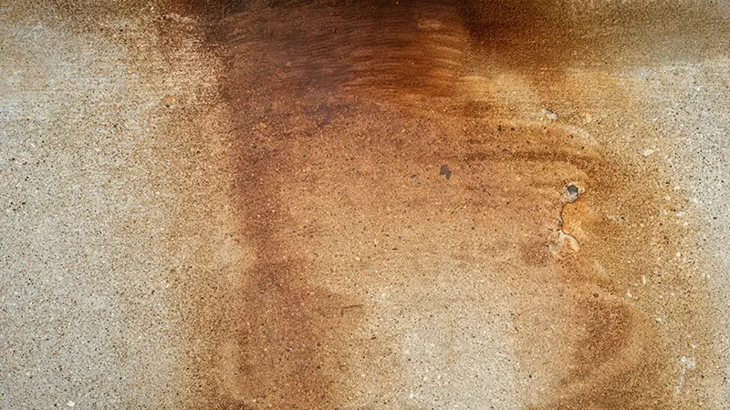 Rust stains on a driveway.