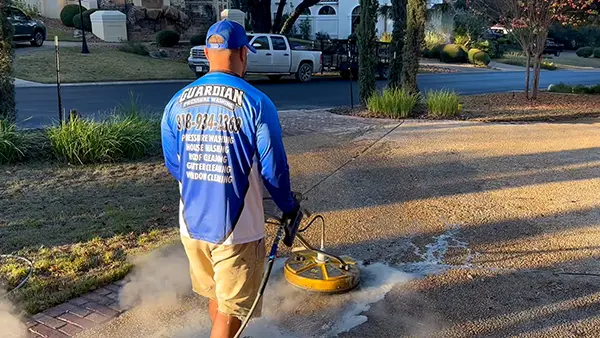 Guardian pressure washing employee