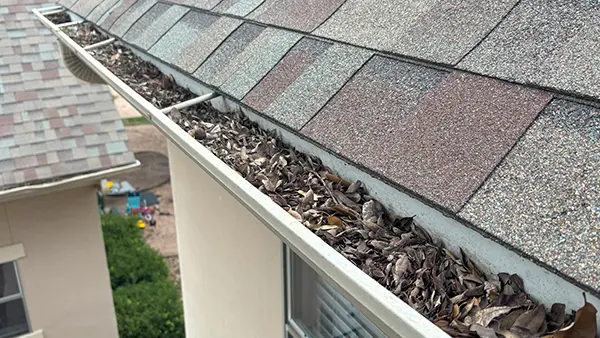 Debris packed into gutters.