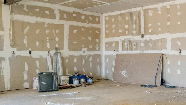 Drywall being installed in a home.