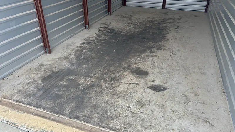 A heavy oil spill on the concrete floor of a storage unit in San Antonio, TX.