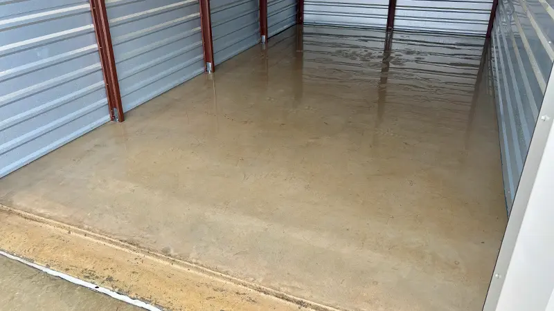 An oil spill that's been pressure washed off the floor of a storage unit in San Antonio, TX.