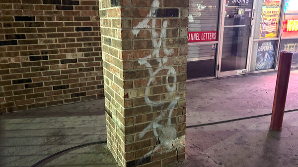 Graffiti on a brick wall.
