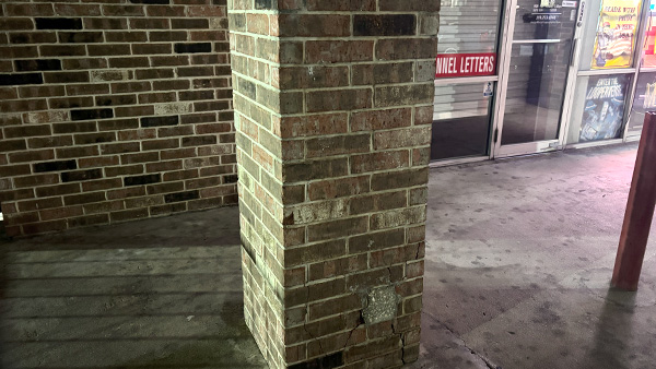 Graffiti removed from a brick wall.