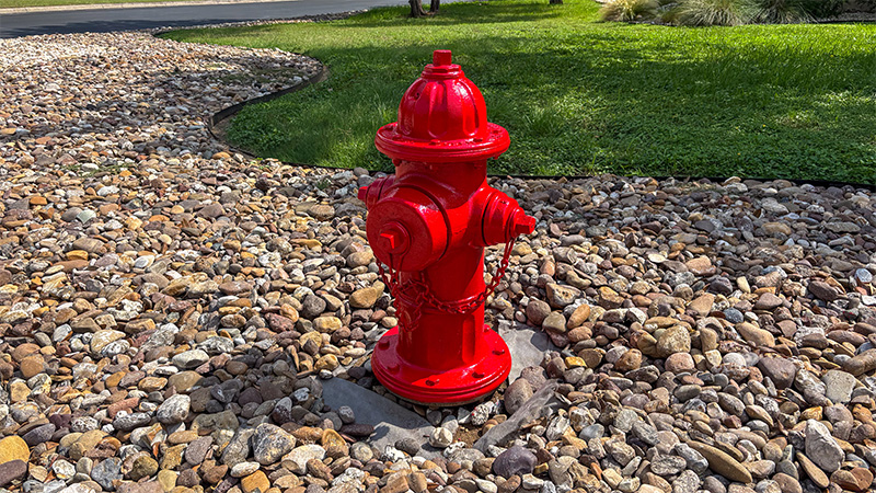 A fire hydrant painted red.